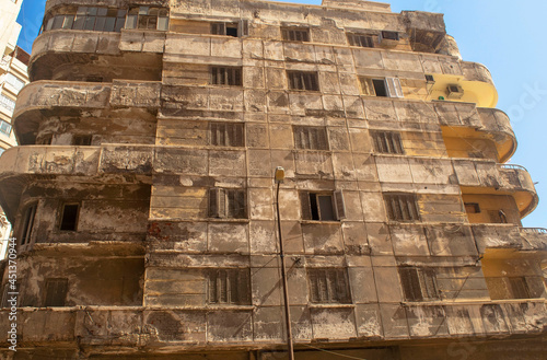 Old abandoned building in the middle of the African city Alexandria. Abandoned shabby buildings