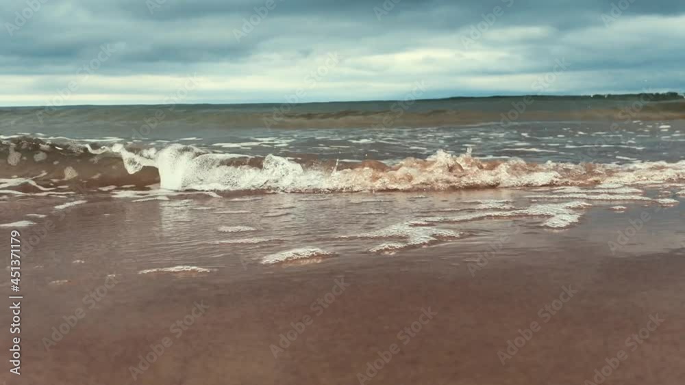 Beautiful landscape, a wave runs on the sandy shore of the sea. Beautiful landscape, a wave runs on the sandy shore of the sea.