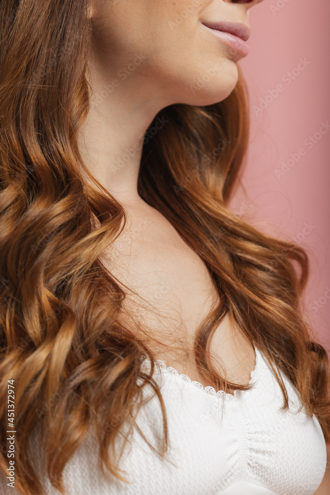 Naklejka premium Close-up portrait of young beautiful red-headed woman without makeup isolated over light studio background. Natural beauty concept.