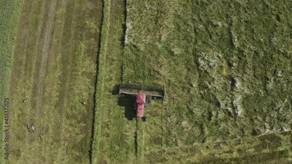 Aerial shot of agriculture eco sustainable farming field. Farming equipment hay mower Aerial shot of agriculture eco sustainable farming field. Farming equipment hay mower