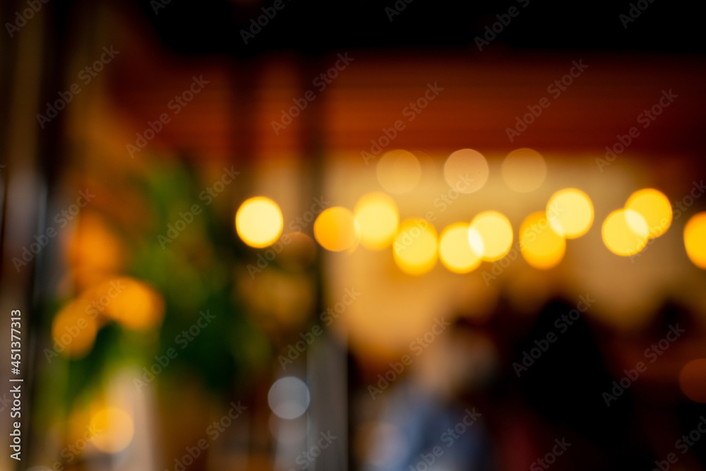 Abstract blur cafe interior background. Defocus lights in coffee shop. Beautiful bokeh.