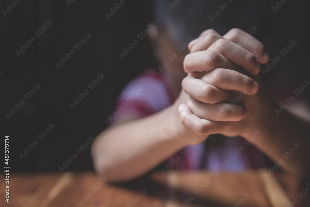 A little prayer, A boy is praying seriously and hopefully to Jesus.