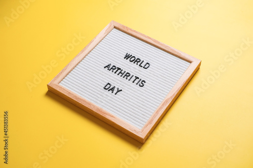 World arthritis day on yellow background