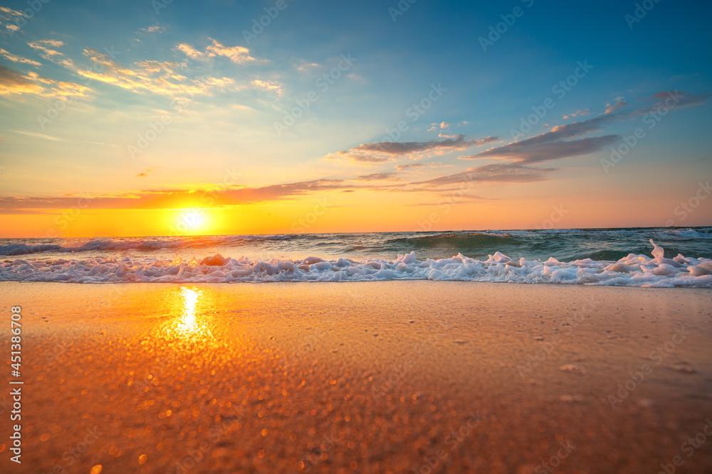 Ocean beach and beautiful sunrise over the coast