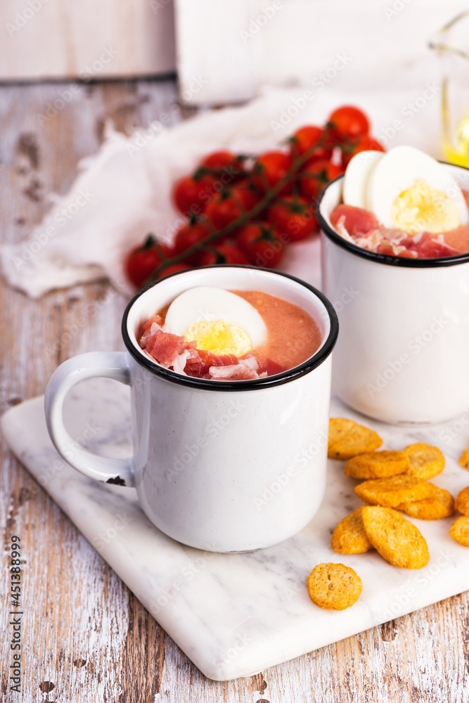 Spanish salmorejo cream soup with ham and egg Spanish salmorejo cream soup with ham and egg