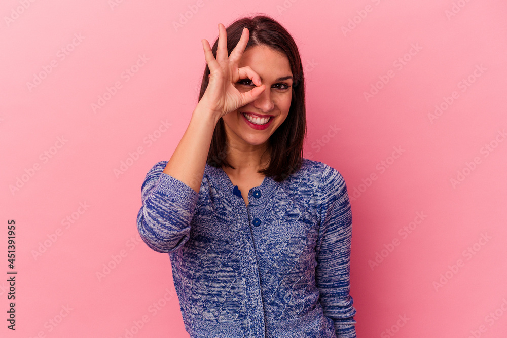 Young caucasian woman isolated on pink background excited keeping ok gesture on eye. Young caucasian woman isolated on pink background excited keeping ok gesture on eye.