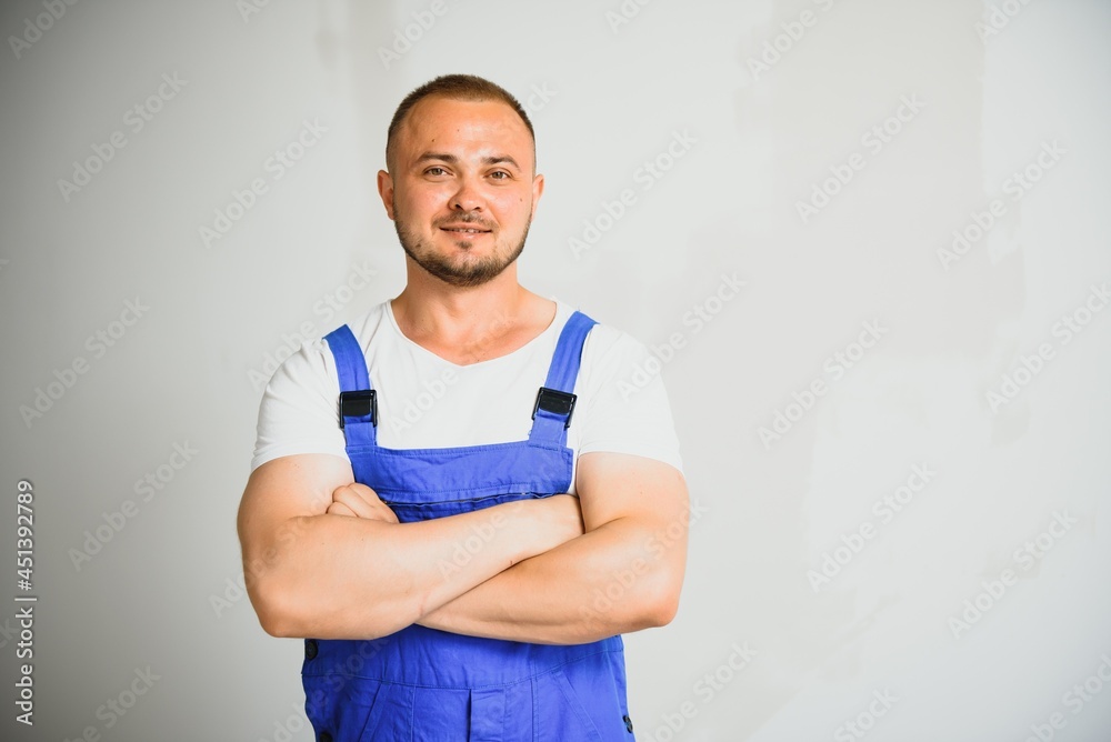 Portrait happy worker, in uniform, on white background, isolated. Repair service concept