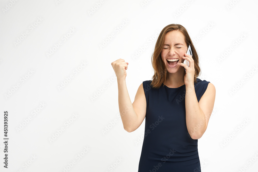 Excited happy woman with clenched fist and telephone Excited happy woman with clenched fist and telephone
