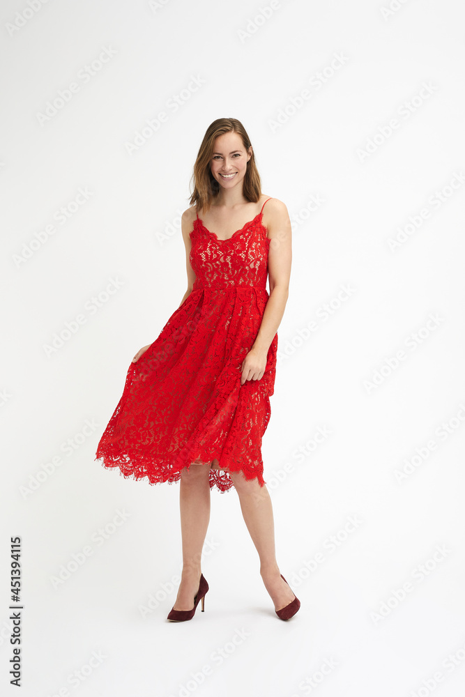 Portrait of a young happy girl in a red dress ready to party Portrait of a young happy girl in a red dress ready to party