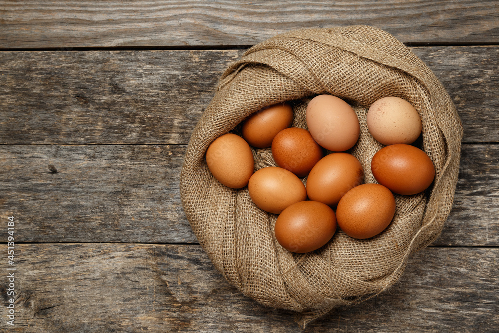 Ecological farm chicken eggs on a rustic wooden table. Ecological farm chicken eggs on a rustic wooden table.