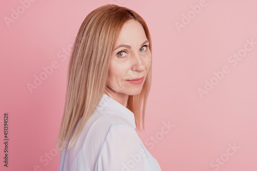 Profile side photo of young confident attractive woman focused wear shirt isolated on pastel pink colour background