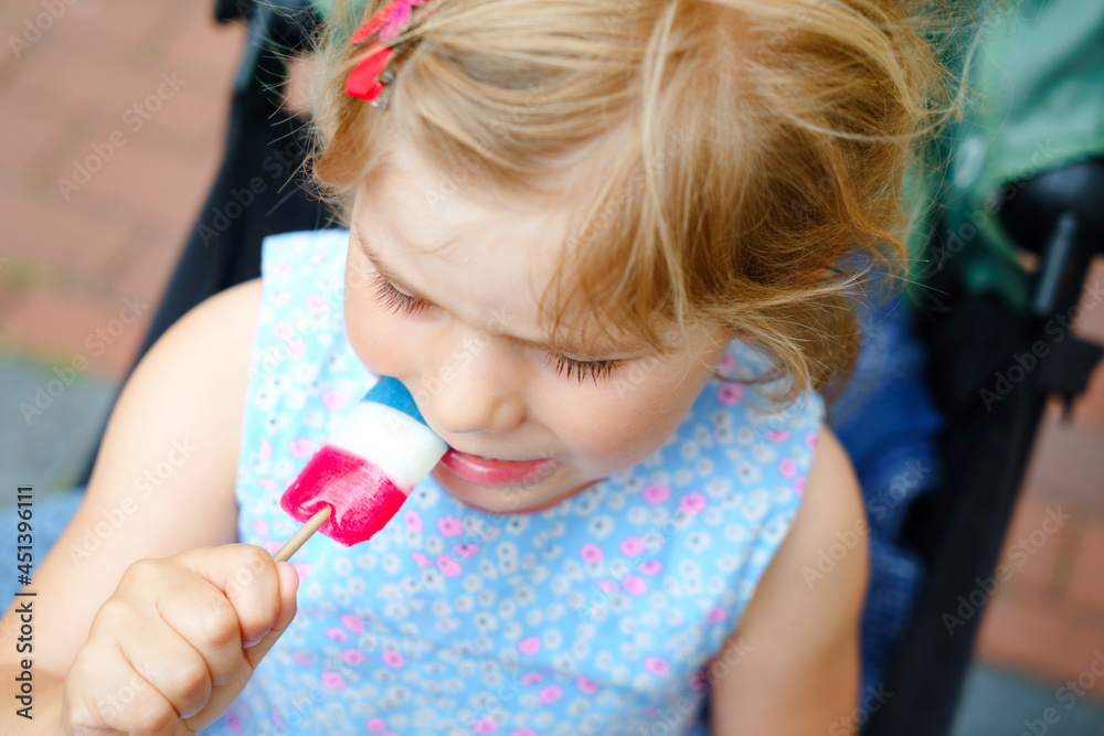 Little preschool girl with lollipop. Cute happy toddler child licking sweet sugar lolli. Happy child with candy. Little preschool girl with lollipop. Cute happy toddler child licking sweet sugar lolli. Happy child with candy.
