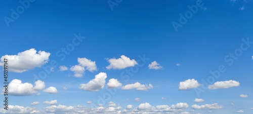 Canvas Print Small cumulus clouds in the clear sky