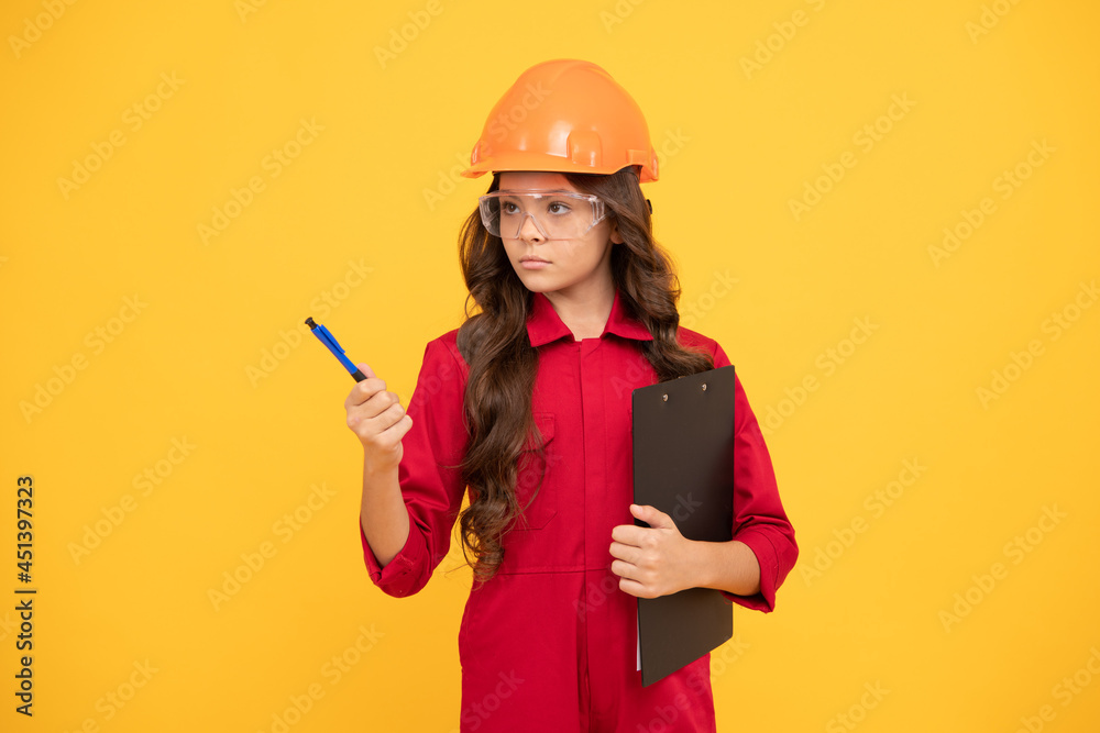 serious teenager girl in protective eyeglasses and helmet hold document folder, worker serious teenager girl in protective eyeglasses and helmet hold document folder, worker