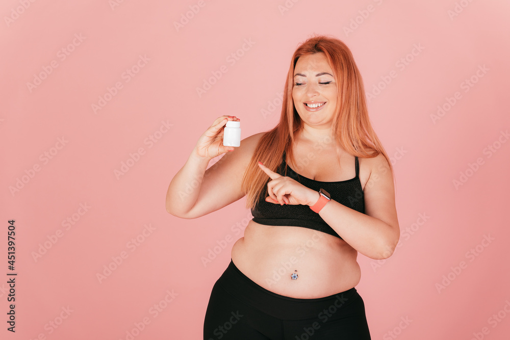 Cheerful oversize woman wearing sports outfit Cheerful oversize woman wearing sports outfit
