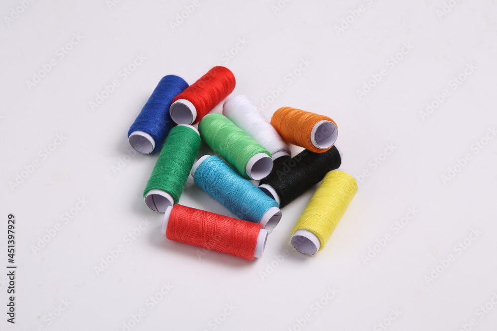 Skeins of colored thread on white background Skeins of colored thread on white background
