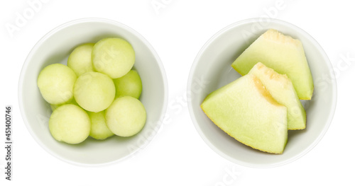Galia melon slices and balls, in white bowls. Freshly cut out spheres and triangular shaped pieces of the ripe fruit Cucumis melo var. reticulatus. Sweet and aromatic hybrid melon also known as sarda.