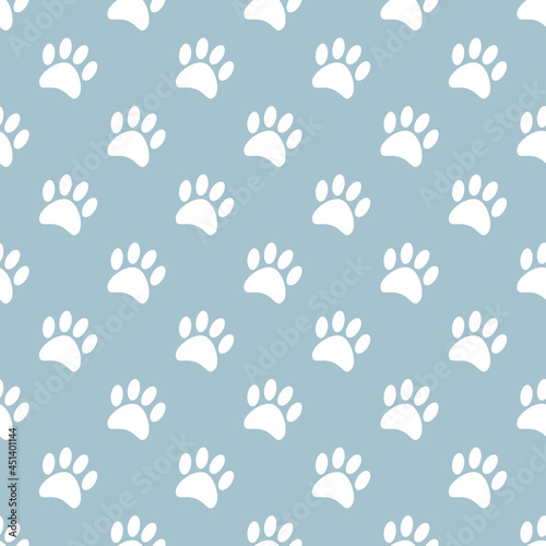 Seamless pattern with cat paws on grey background