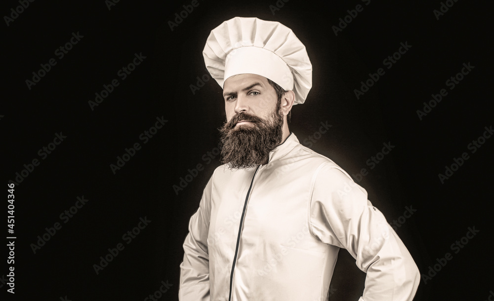 Cook hat. Serious cook in white uniform, chef hat. Portrait of a serious chef cook Cook hat. Serious cook in white uniform, chef hat. Portrait of a serious chef cook