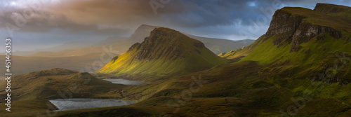 Dramatic mountains of the Isle of Skye seen from viewpoint on the Quiraing. Large panorama with dark moody clouds. Scotland landscapes, Inner Hebrides, UK.