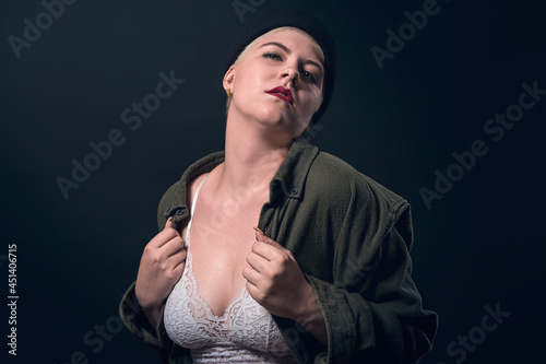 portrait of a young woman with a man's shirt, cap, and bustier photo