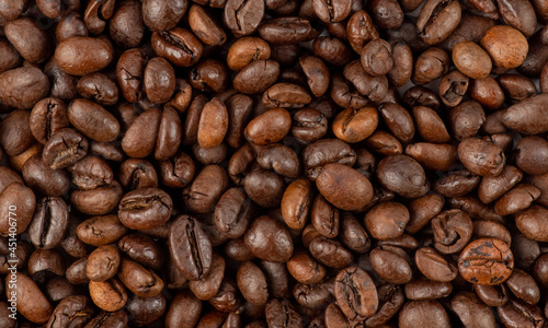 Fresh roasted coffee beans texture. Texture of roasted coffee beans. Freshly roasted coffee beans background. roasted coffee bean background  top view
