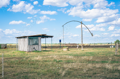 Traditional water well on the hungarian plain (puszta) photo