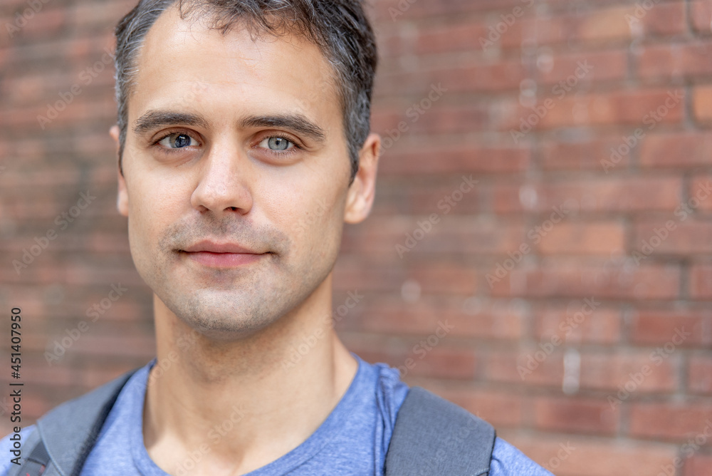 Close up portrait of smiling latin man with heterochromia Close up portrait of smiling latin man with heterochromia