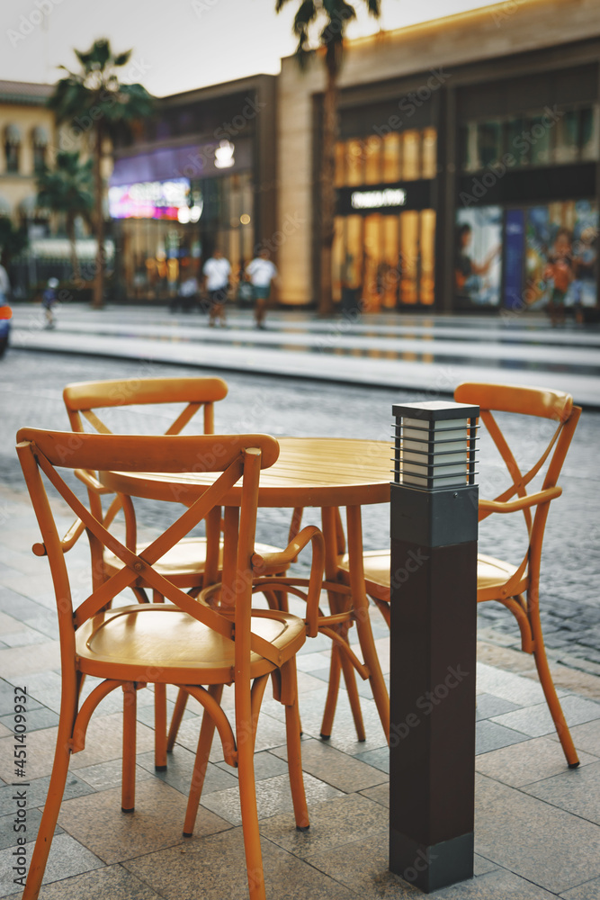 Empty table and chairs of street cafe