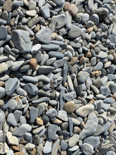 Pebbles or stones on the beach. 