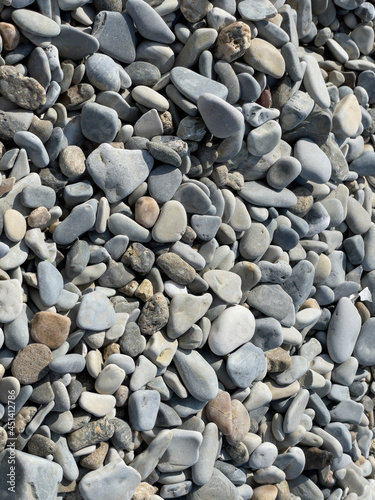 Pebbles or stones on the beach. 