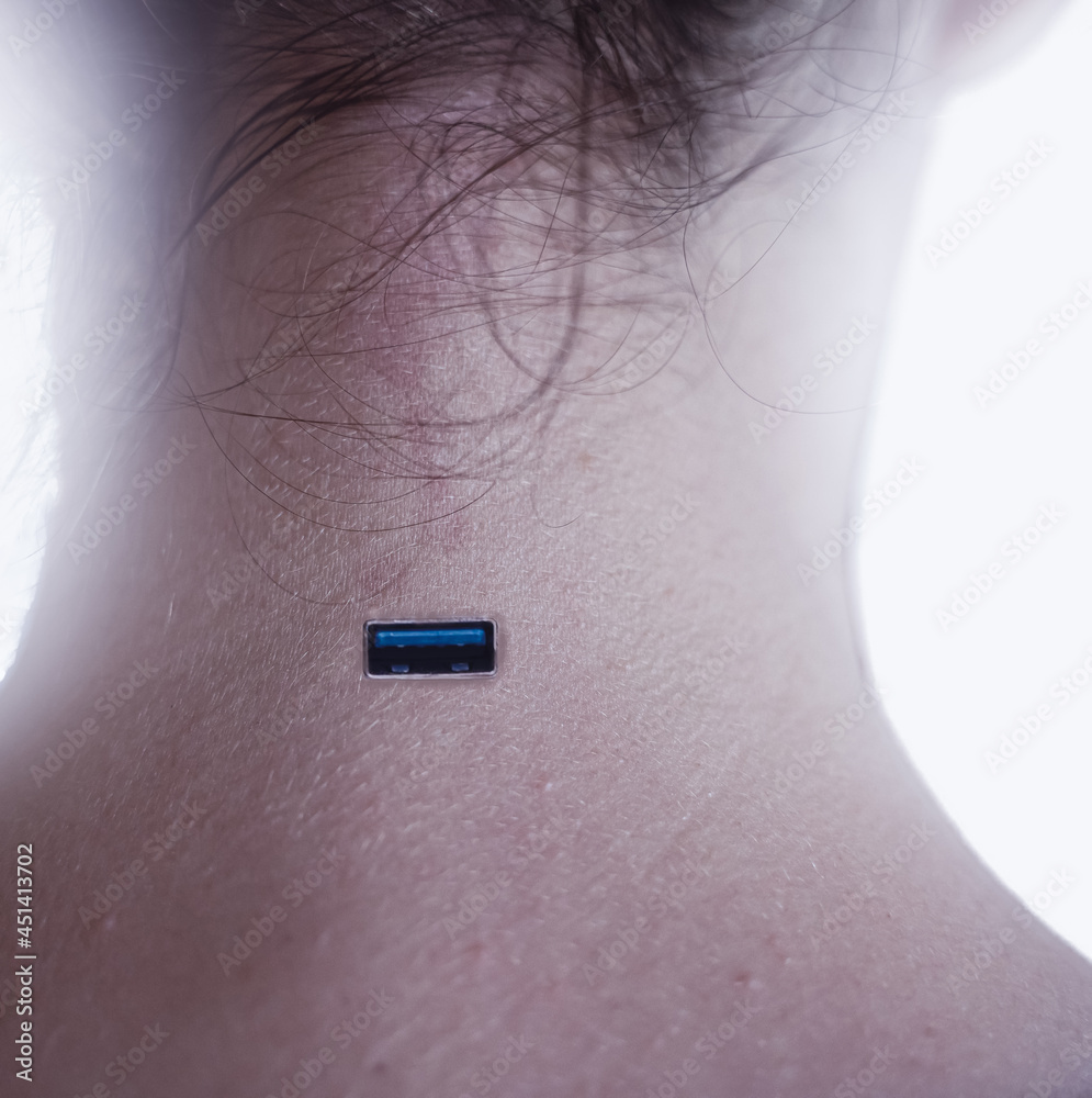 Obraz premium USB plug integrated into the neck of a person illustrating human and technology merging. Isolated on white background with shallow depth of field.