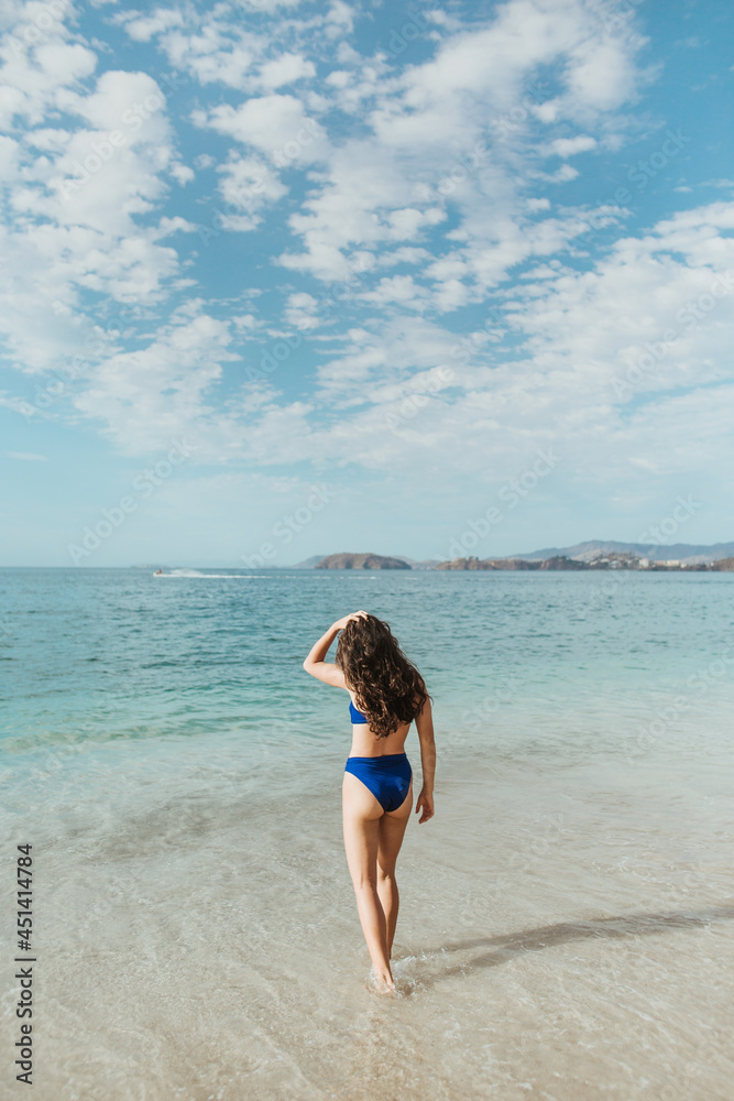 Anonymous woman spending summer day on beach Anonymous woman spending summer day on beach