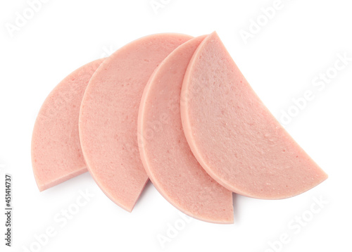 Slices of tasty boiled sausage on white background, top view