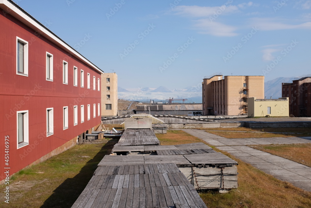 wooden pathway in old abandoned rusisan village svalbard