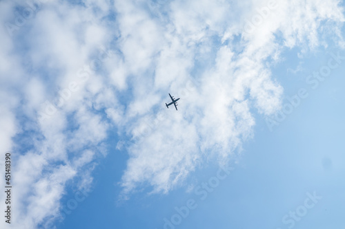 Flying passenger plane on blue sky background