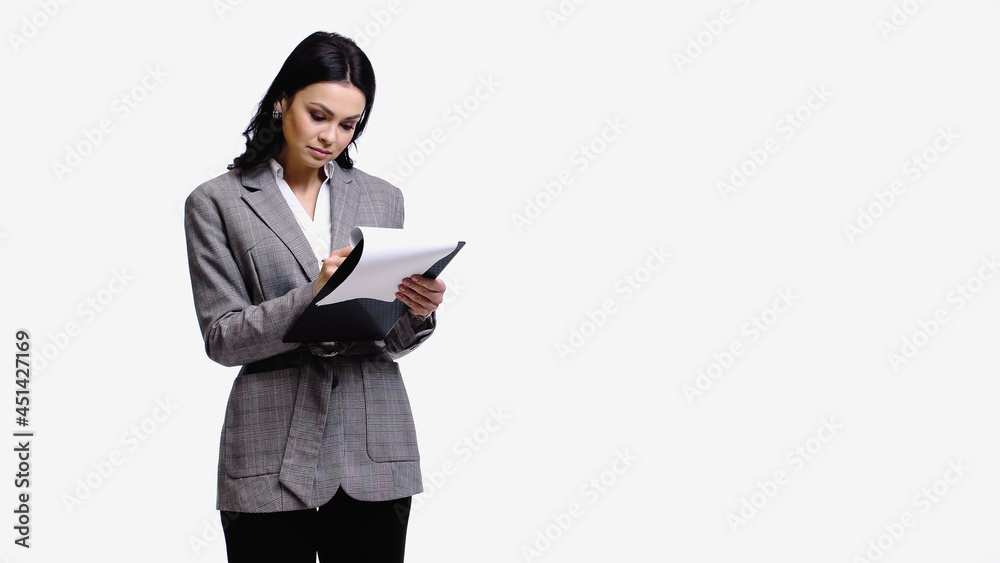 Young businesswoman holding clipboard with papers isolated on white. Young businesswoman holding clipboard with papers isolated on white.
