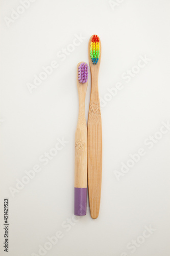 Bamboo toothbrushes on a white background. Colored bristles.