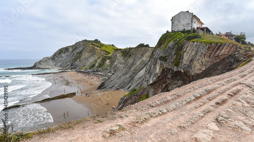 Zumaia, Spain - 14 August 2021: San Telmo Church and the Flysch Cliffs on the coast of Zumaia photo