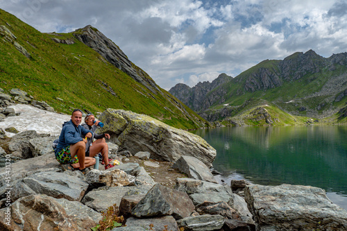 Couple of hikers enjoying the sights of summer in the Alps