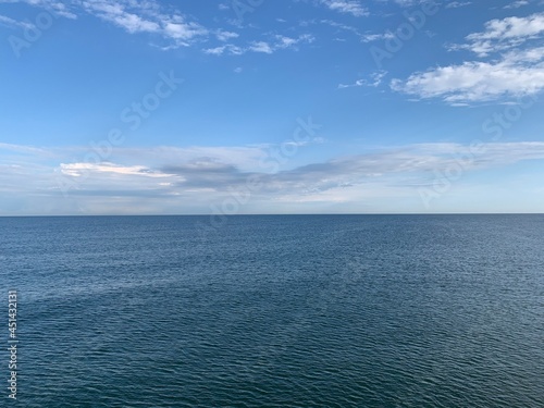 Perfect seascape horizon, natural sea view background, blue sky, surface of the water