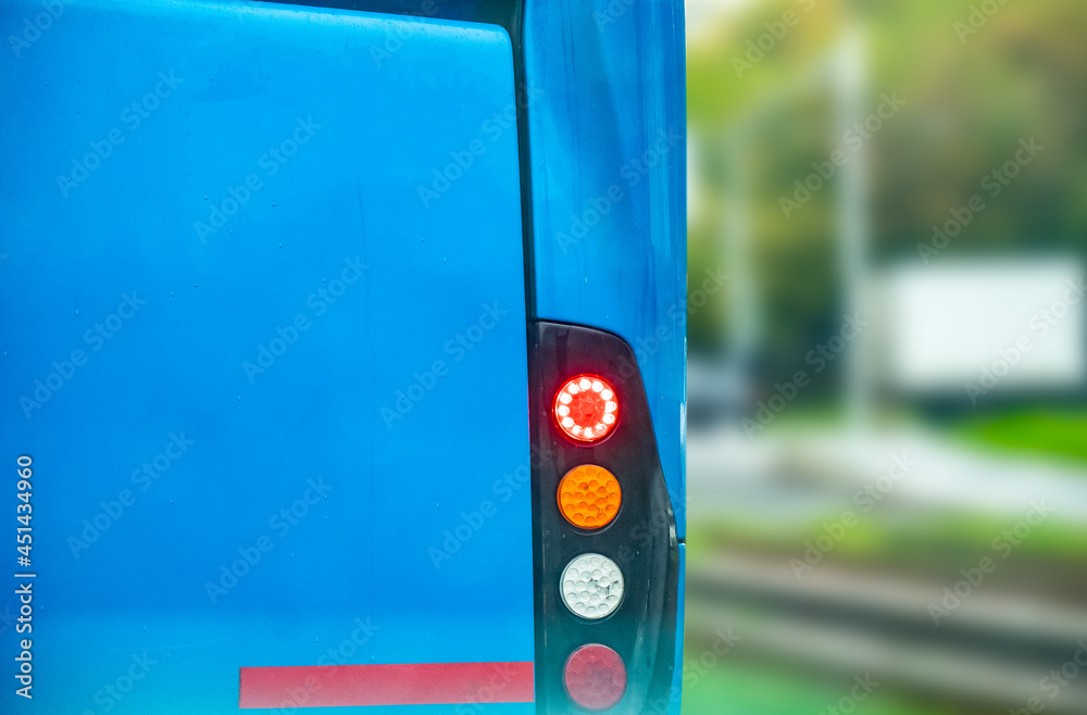 Backlights of a blue colored bus