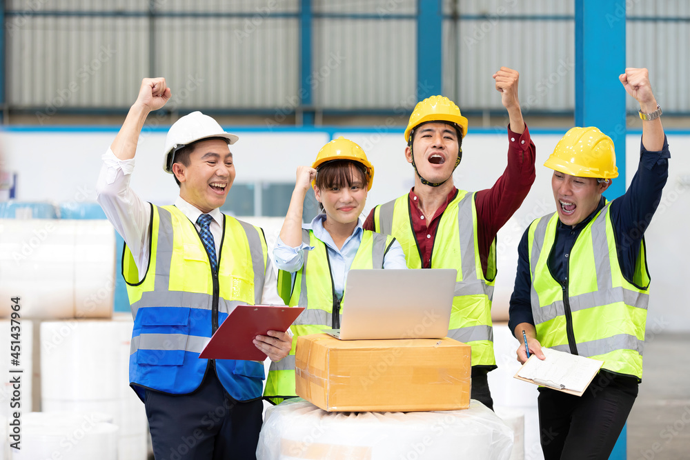 factory workers raised arm to laptop computer for success a job and celebrating joyful news factory workers raised arm to laptop computer for success a job and celebrating joyful news