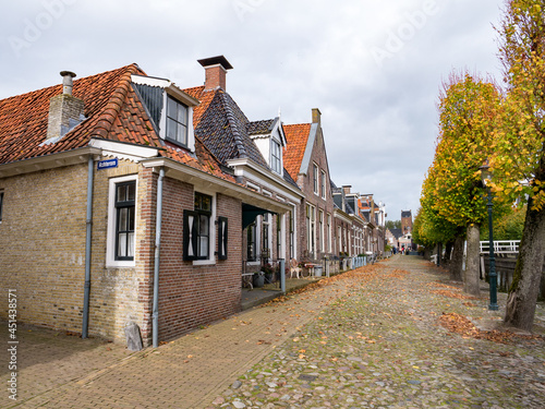 Terraced houses on Voorstreek quay in city of Sloten, Sleat, in Friesland, Netherlands photo