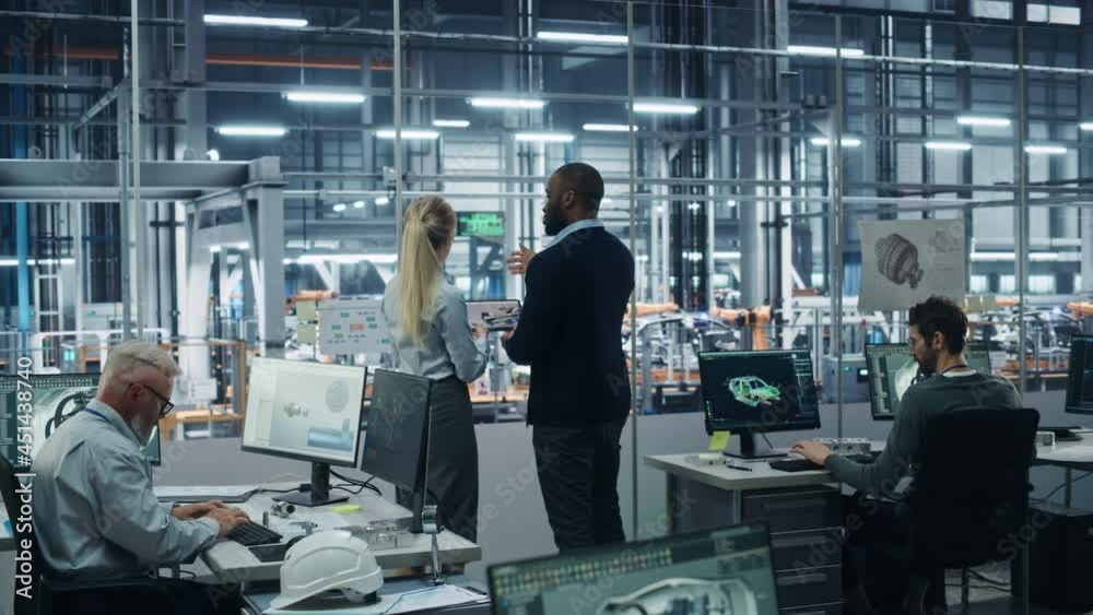 Car Factory Office: Team of Automotive Engineers Working, Talk, Use Tablet Computers to Design Advanced 3D Models for High-Tech Engines. Automated Robot Arm Assembly Line Manufacturing Vehicles