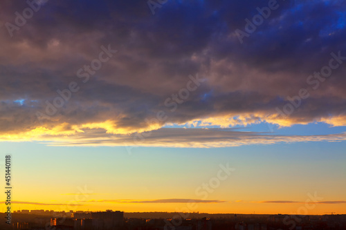 Evening clouds over the city . Cloudscape over the horizon in the twilight