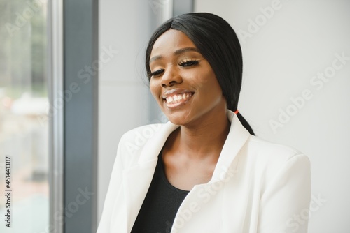 portrait of young pretty african american businesswoman in office