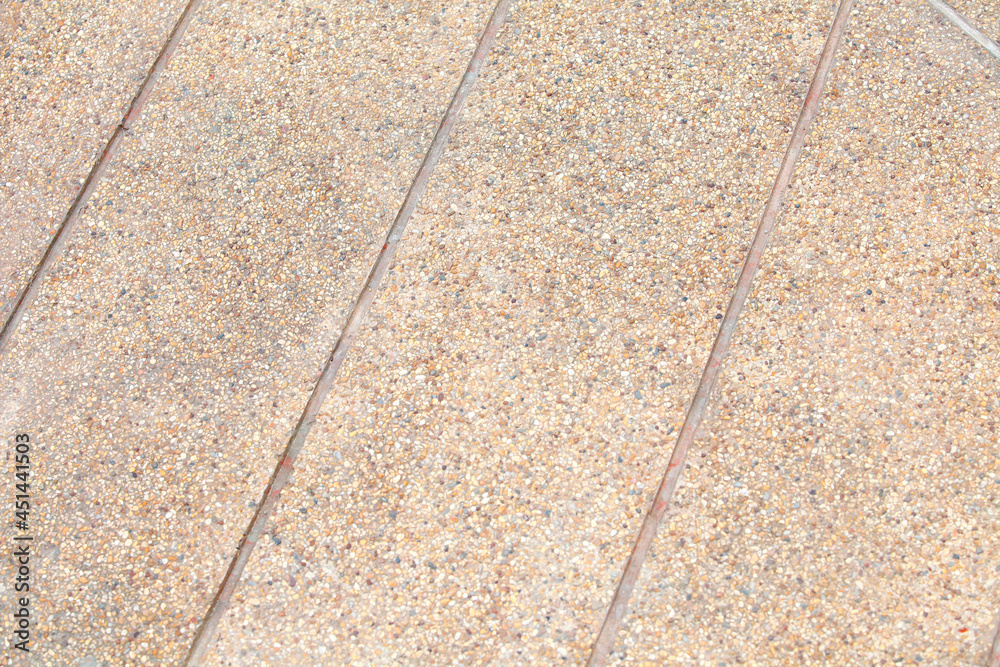 Ramp way for support wheelchair disabled people made from sand and small gravel stone washed floor.