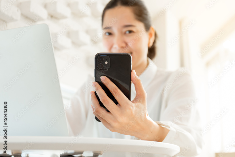 woman work using texting cell phone typing computer.student study education online learning.adult professional chatting on laptop,mobile contact us at Thinking business plan.connecting people concept woman work using texting cell phone typing computer.student study education online learning.adult professional chatting on laptop,mobile contact us at Thinking business plan.connecting people concept