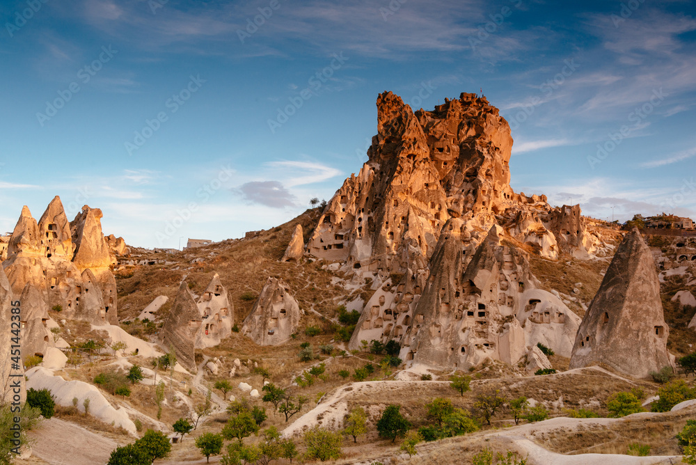Amazing view of Uchisar Castle at suset.  The high castle mountain, which is visible over a wide distance. Goreme National Park. Cappadocia.Turkey. Traveling concept background.